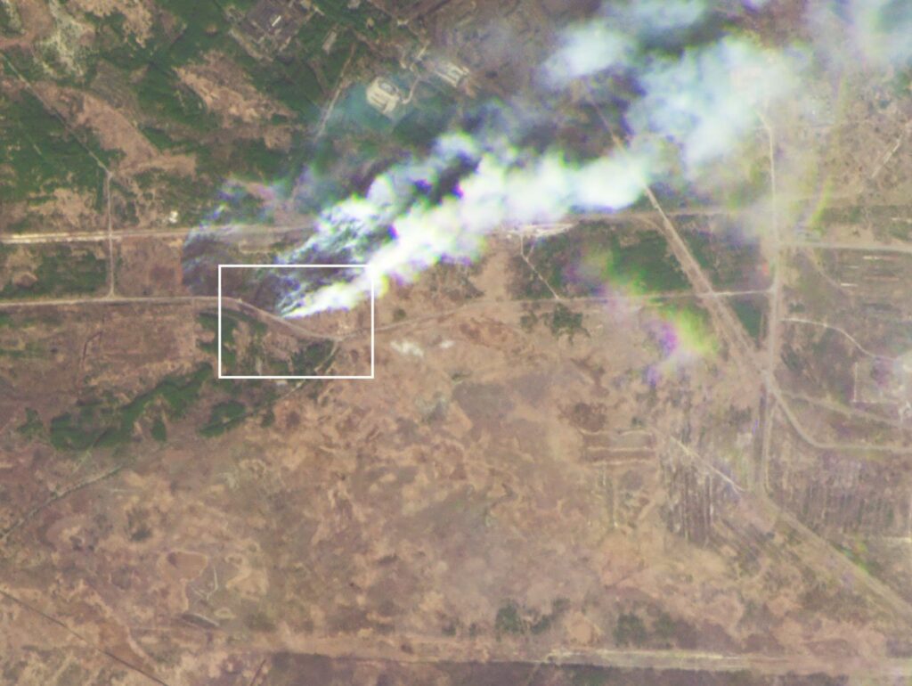NPR: A March 28 image shows wildfires burning near the site of the encampment. The white square showing the same area as the previous image, taken on March 16 (Image credit: Planet Labs, via PBC)
